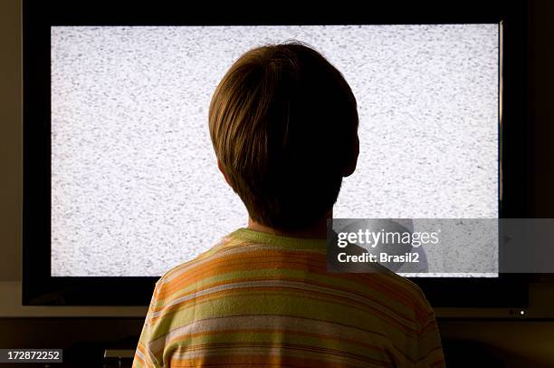 watching tv - person with in front of screen stockfoto's en -beelden