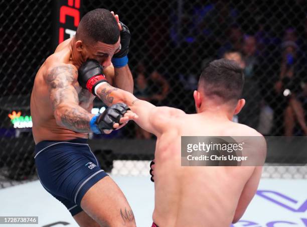 Rickson Zenidim of Brazil punches Andre Lima of Brazil in a featherweight fight during Dana White's Contender Series season seven, week ten at UFC...