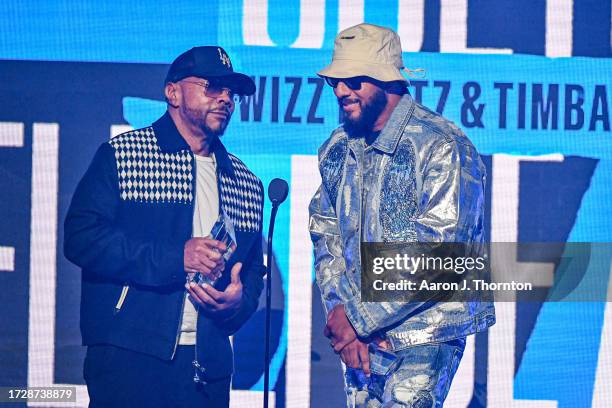 In this image released on October 10 Timbaland and Swizz Beatz speak onstage during the BET Hip Hop Awards at Cobb Energy Performing Arts Center on...
