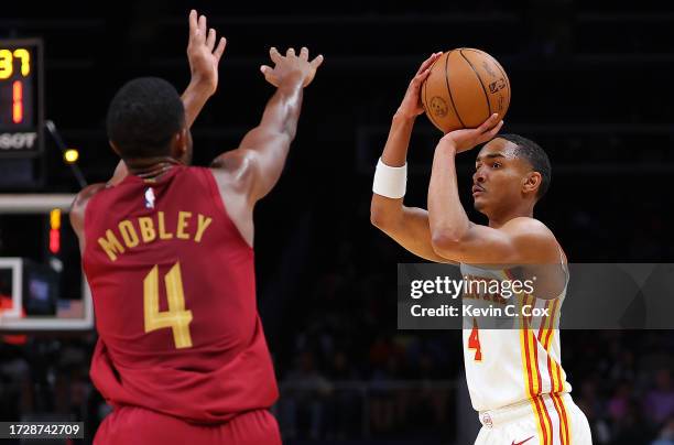 Kobe Bufkin of the Atlanta Hawks shoots against Evan Mobley of the Cleveland Cavaliers during the second quarter at State Farm Arena on October 10,...