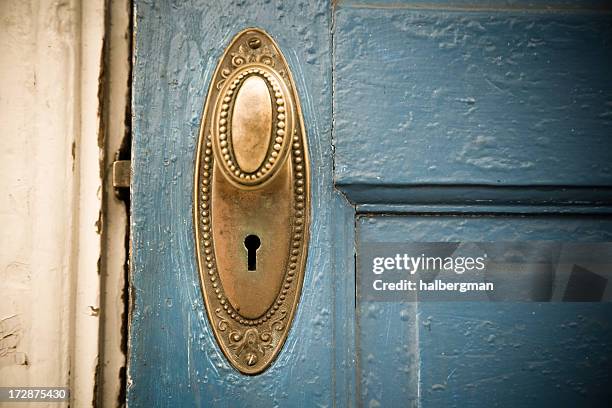 brass doorknob on a blue door - doorknob stock pictures, royalty-free photos & images