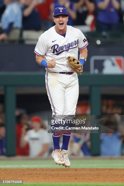 Josh Jung of the Texas Rangers celebrates after defeating the Baltimore Orioles in Game Three of the Division Series at Globe Life Field on October...