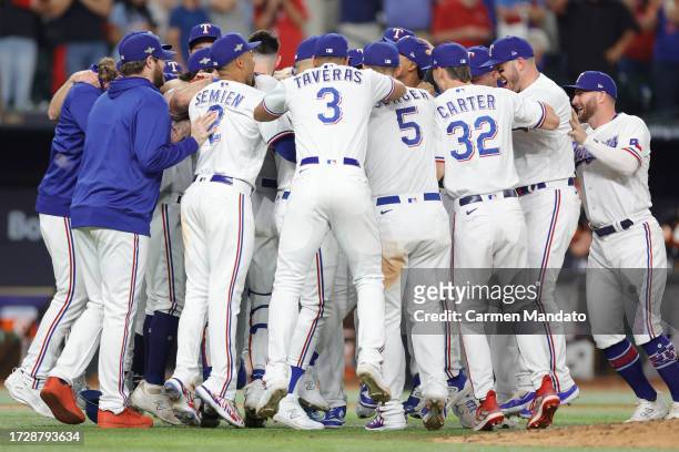 Members of the Texas Rangers celebrate after defeating the Baltimore Orioles in Game Three of the Division Series at Globe Life Field on October 10,...