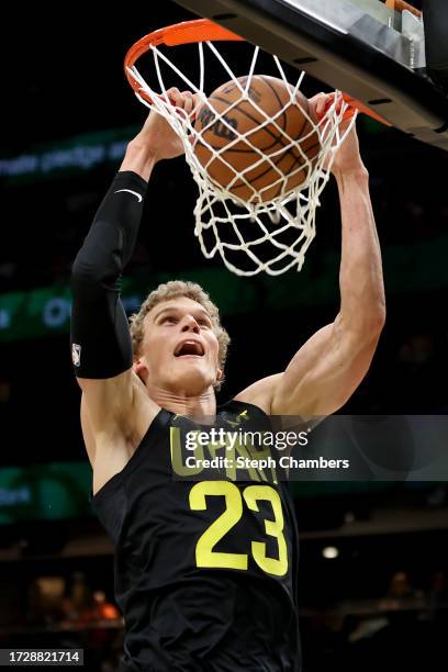 Lauri Markkanen of the Utah Jazz dunks against the LA Clippers during the first quarter of the Rain City Showcase in a preseason NBA game at Climate...