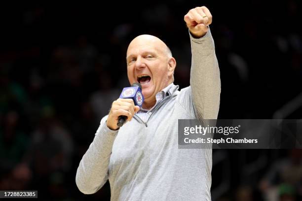 Steve Ballmer, owner of the LA Clippers, pumps up the crowd before the Rain City Showcase in a preseason NBA game between the LA Clippers and the...