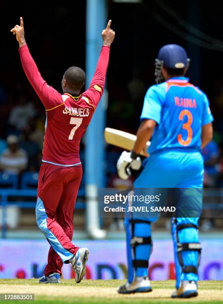 West Indies cricketer Marlon Samuels celebrates dismissing Indian batsman Suresh Raina during the fourth match of the Tri-Nation series between India...