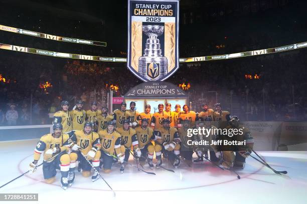 The Vegas Golden Knights pose for a team photo as the Stanley Cup Championship banner is raised prior to a game against the Seattle Kraken at...