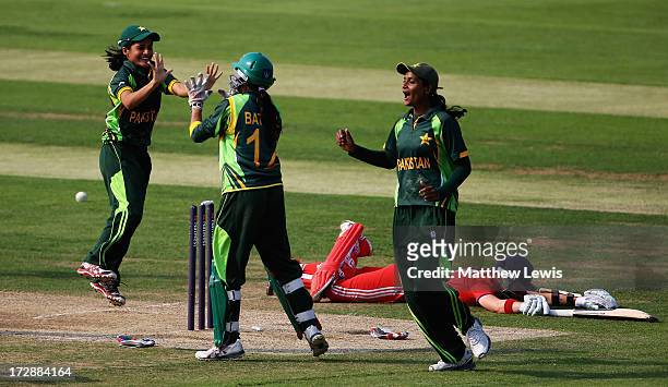 Batool Fatima of Pakistan is congratulated by team mates, after she ran out Arran Brindle of England during the 2nd NatWest Women's International T20...