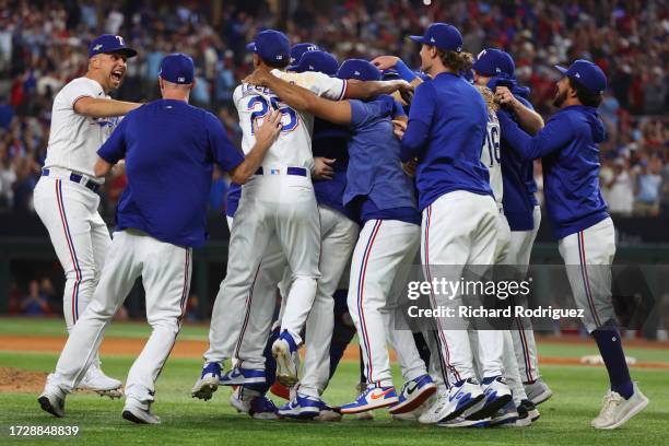 Texas Rangers players celebrate after defeating the Baltimore Orioles in Game Three of the Division Series at Globe Life Field on October 10, 2023 in...