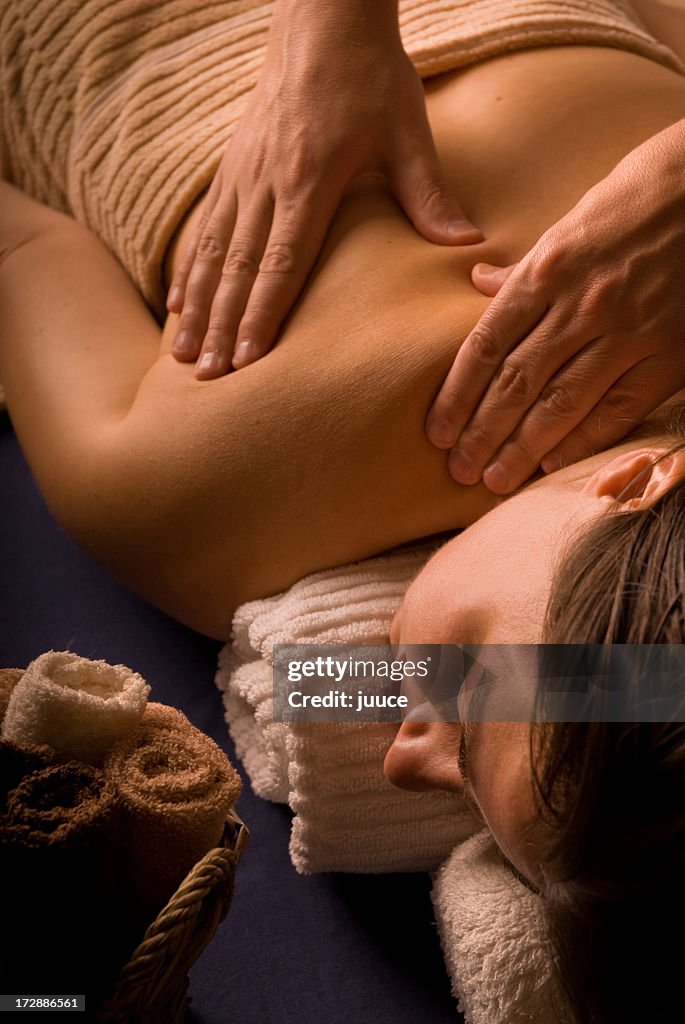 A woman enjoying a massage at the day spa