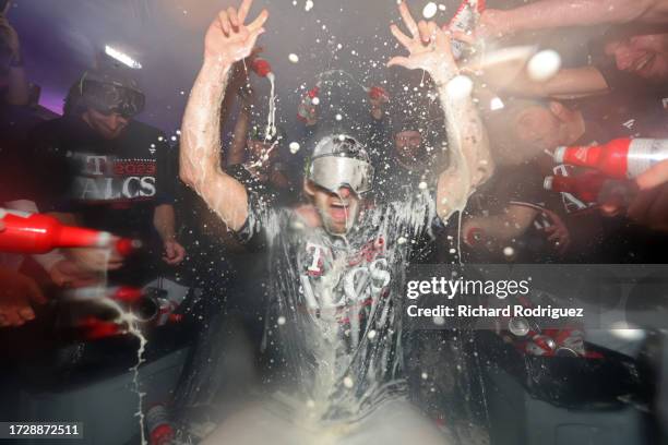 Nathan Eovaldi of the Texas Rangers celebrates in the locker room after defeating the Baltimore Orioles in Game Three of the Division Series at Globe...