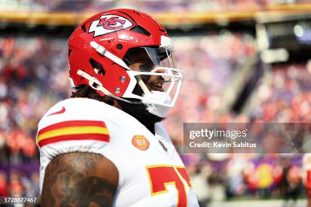Lucas Niang of the Kansas City Chiefs smiles prior to an NFL football game against the Minnesota Vikings at U.S. Bank Stadium on October 8, 2023 in...