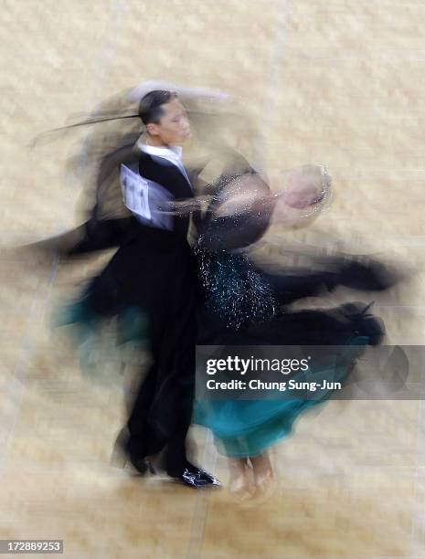 Zhao Peng and partner Wang Qi of China compete in the Dancesport- Standard Five Dances Waltz Final at Samsan World Gymnasium during day seven of the...