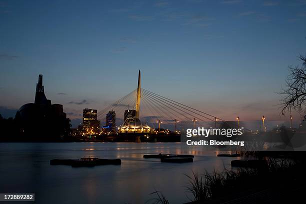 Buildings stand in the skyline of Winnipeg, Manitoba, Canada, on Thursday, July 4, 2013. Canada extended the longest streak of merchandise trade...