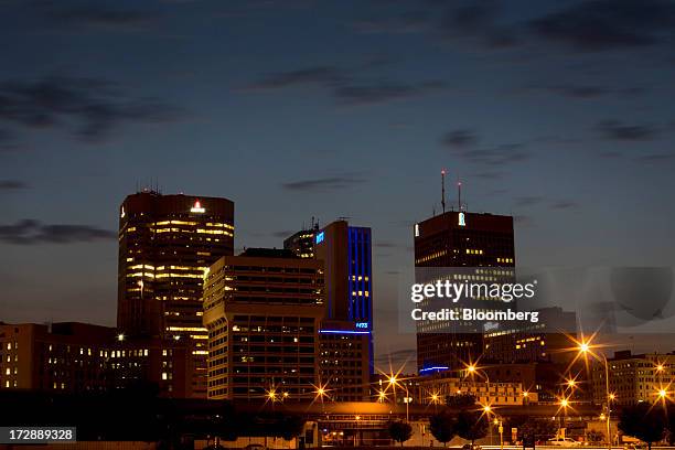 Buildings stand in the skyline of Winnipeg, Manitoba, Canada, on Thursday, July 4, 2013. Canada extended the longest streak of merchandise trade...