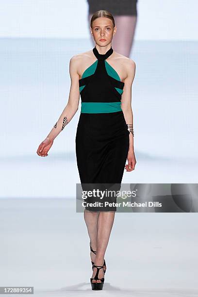 Model walks the runway at the Ece Goezen, Nazli Bozdag, Nevra Karaca No. 7 Show during Mercedes-Benz Fashion Week Spring/Summer 2014 at Brandenburg...