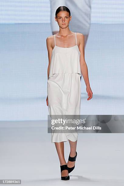 Model walks the runway at the Ece Goezen, Nazli Bozdag, Nevra Karaca No. 7 Show during Mercedes-Benz Fashion Week Spring/Summer 2014 at Brandenburg...