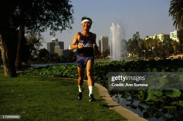 Portrait session with actor George Takei as he runs in Echo Park