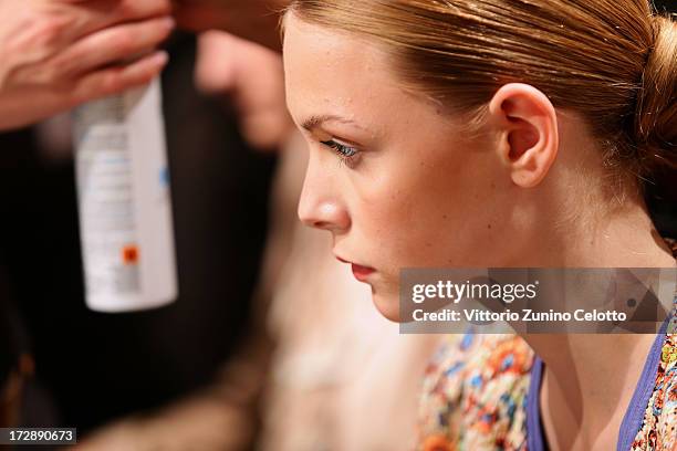 Model being styled backstage ahead of the Ece Goezen, Nazli Bozdag, Nevra Karaca No. 7 Show during Mercedes-Benz Fashion Week Spring/Summer 2014 at...