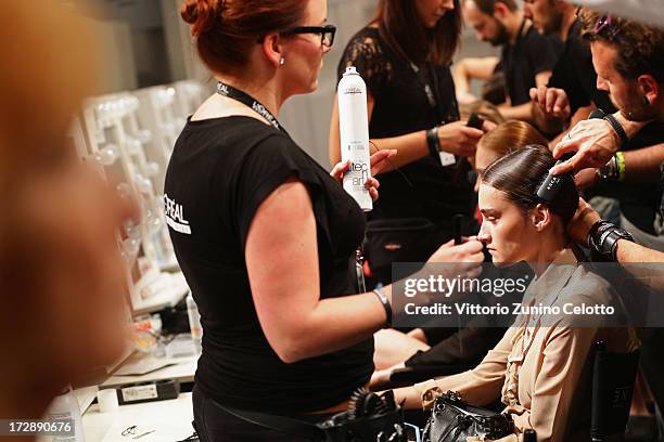 Model being styled backstage ahead of the Ece Goezen, Nazli Bozdag, Nevra Karaca No. 7 Show during Mercedes-Benz Fashion Week Spring/Summer 2014 at...