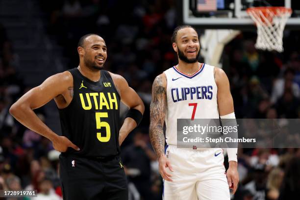 Talen Horton-Tucker of the Utah Jazz and Amir Coffey of the LA Clippers talk during the fourth quarter of the Rain City Showcase in a preseason NBA...