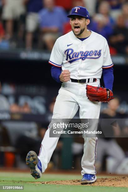 Nathan Eovaldi of the Texas Rangers celebrates after striking out Jordan Westburg of the Baltimore Orioles to end the seventh inning in Game Three of...