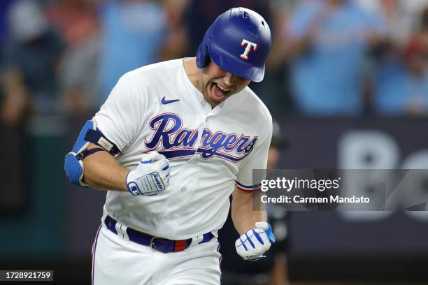 Nathaniel Lowe of the Texas Rangers celebrates after his solo home run against the Baltimore Orioles during the sixth inning in Game Three of the...