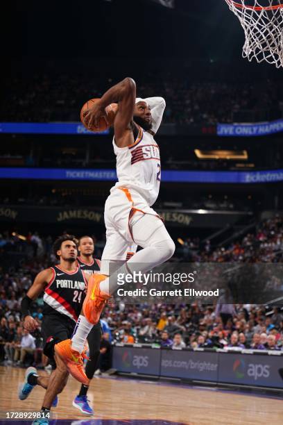 Josh Okogie of the Phoenix Suns dunks the ball during the game against the Portland Trail Blazers on October 16, 2023 at Footprint Center in Phoenix,...