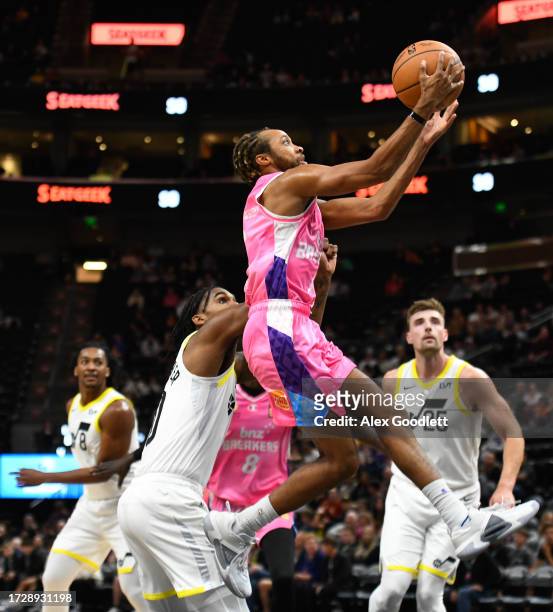 Parker Jackson-Cartwright of the New Zealand Breakers drives past Leandro Bolmaro of the Utah Jazz during the second half of a preseason game at...