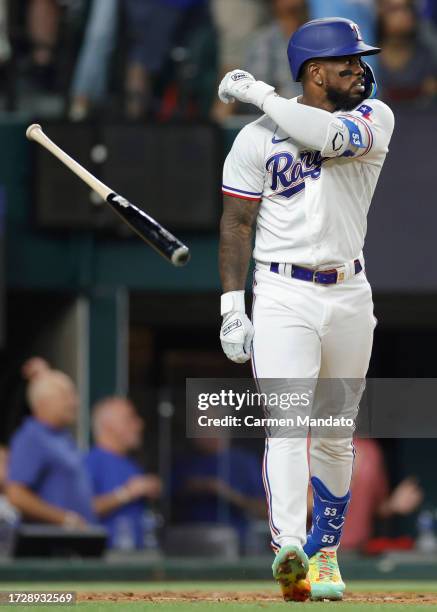 Adolis Garcia of the Texas Rangers celebrates after hitting a three-run home run against the Baltimore Orioles during the second inning in Game Three...