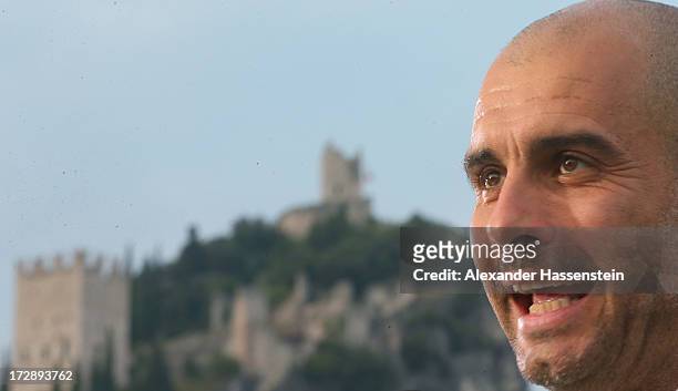 Josep Guardiola, head coach of FC Bayern Muenchen smiles in front of the Arco castel after the friendly match between Paulaner Traumelf and FC Bayern...