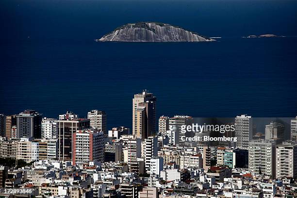 The Ipanema Beach skyline stands below one of the Cagarra Islands in this aerial photograph of Rio de Janeiro, Brazil, on Thursday, July 4, 2013....
