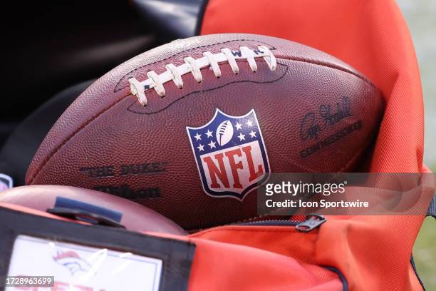 View of an NFL logo on a football and equipment bag durng an AFC West matchup between the Denver Broncos and Kansas City Chiefs on Oct 12, 2023 at...