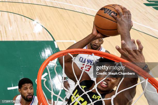 Collin Sexton of the Utah Jazz attempts to dunk against the LA Clippers during the second quarter of the Rain City Showcase in a preseason NBA game...