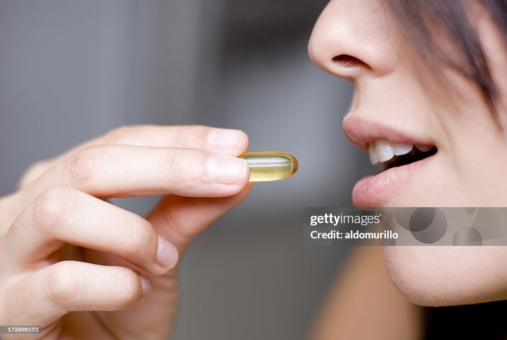 Woman taking medicine