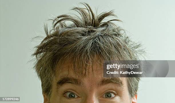 wide eyed male with crazy bed head on white background - man with gray hair stock pictures, royalty-free photos & images