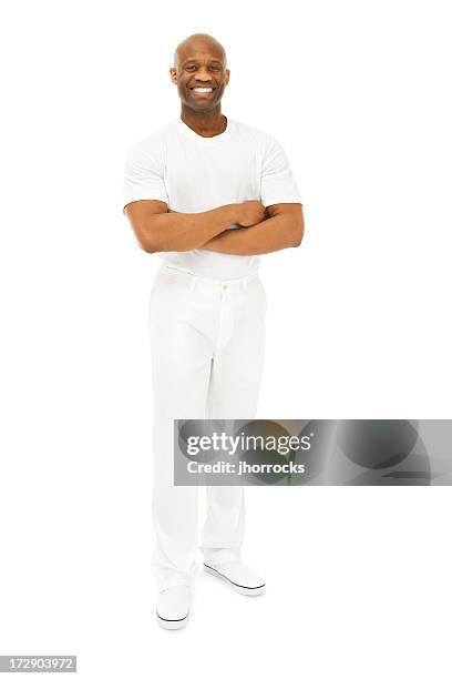 smiling confident african american man in white - pants stock pictures, royalty-free photos & images