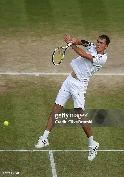 Jerzy Janowicz of Poland smashes the ball during the Gentlemen's Singles semi-final match against Andy Murray of Great Britain on day eleven of the...