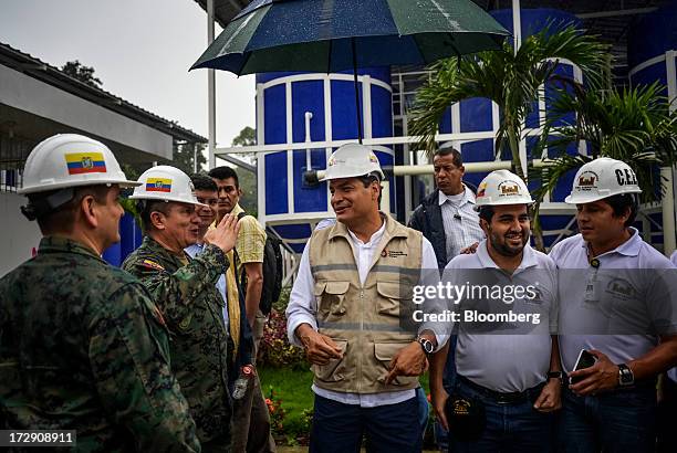 Rafael Correa, president of Ecuador, center, tours a new water treatment plant in Puerto Lopez, Ecuador, on Saturday, June 29, 2013. Ecuador, the...