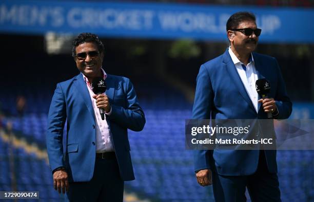 Commentators Sanjay Manjrekar and Ravi Shastri look on during the ICC Men's Cricket World Cup India 2023 between India and Afghanistan at Arun...