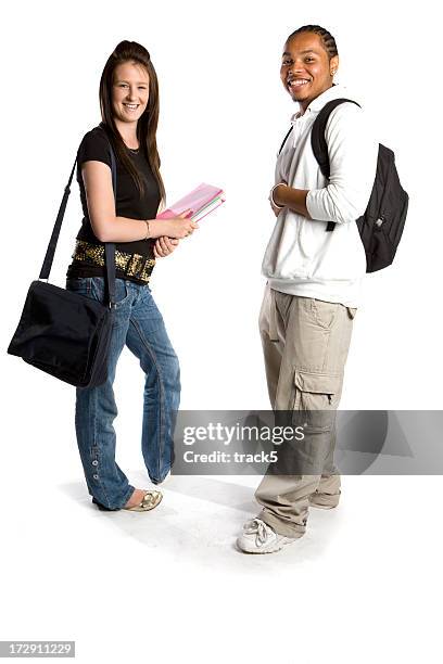 teenage students: friendly smiles from a pair of school friends - looking around on white background stock pictures, royalty-free photos & images