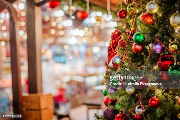 christmas blur street decoration on the open market. - christmas decoration stock pictures, royalty-free photos & images