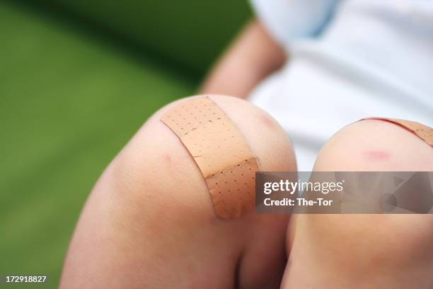 bandaid - knees stock pictures, royalty-free photos & images