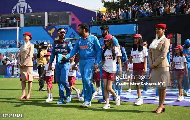 Rohit Sharma of India and Hashmatullah Shahidi of Afghanistan lead their sides out for the National Anthems ahead of the ICC Men's Cricket World Cup...