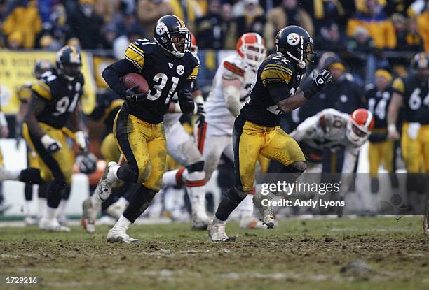 Mike Logan of the Pittsburgh Steelers returns an interception 14 yards to the Steelers 39 yardline at 7:50 of the third quarter of the AFC Wild Card...