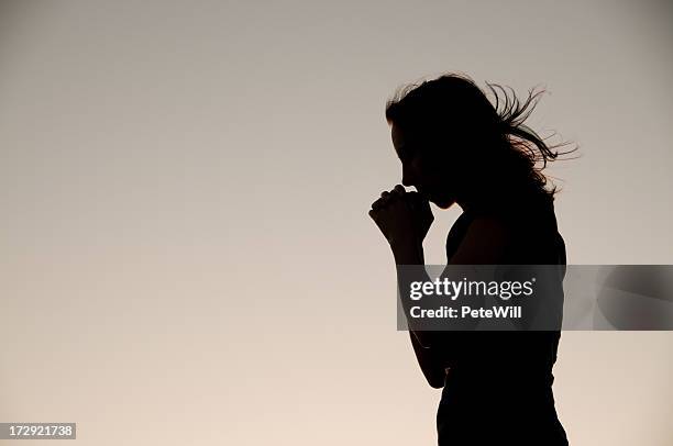 prayer silhouette - humble beginnings stock pictures, royalty-free photos & images