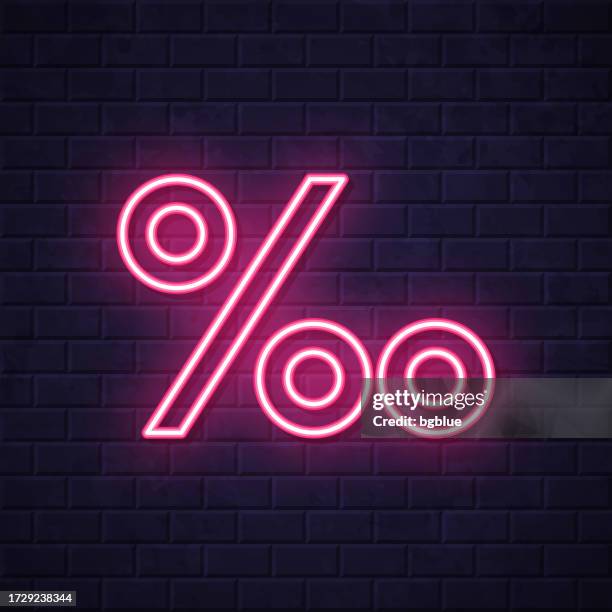 per mille symbol. glowing neon icon on brick wall background - zero percent icon stock illustrations
