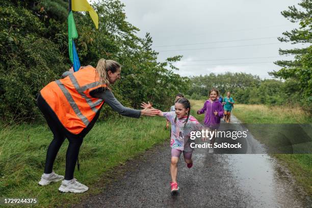 congratulating the winner - kids sports equipment stock pictures, royalty-free photos & images