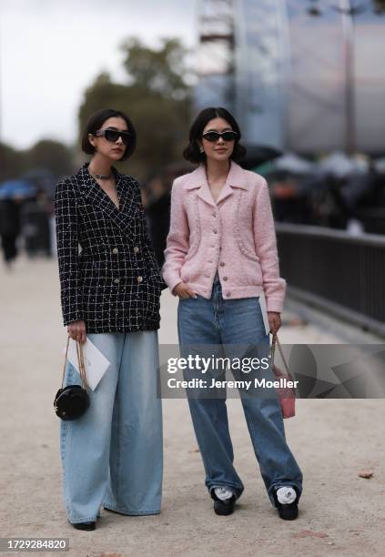 Guests are seen outside Chanel show wearing black Chanel sunnies, rose tweed Chanel jacket, black and white checkered tweed Chanel blazer, oversized...