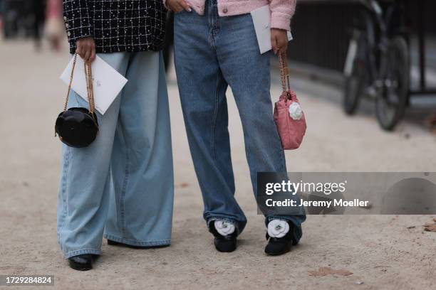 Guests are seen outside Chanel show wearing black Chanel sunnies, rose tweed Chanel jacket, black and white checkered tweed Chanel blazer, oversized...